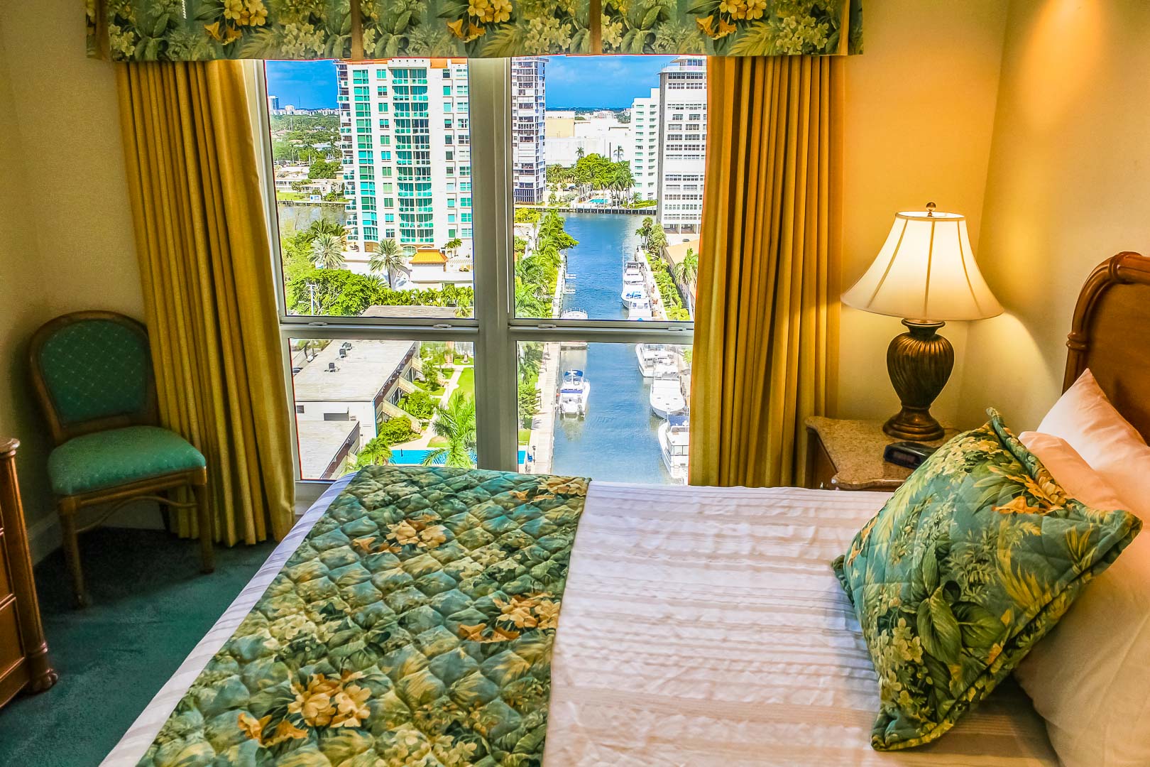 A master bedroom with a beautiful view at VRI's Ft. Lauderdale Beach Resort in Florida.